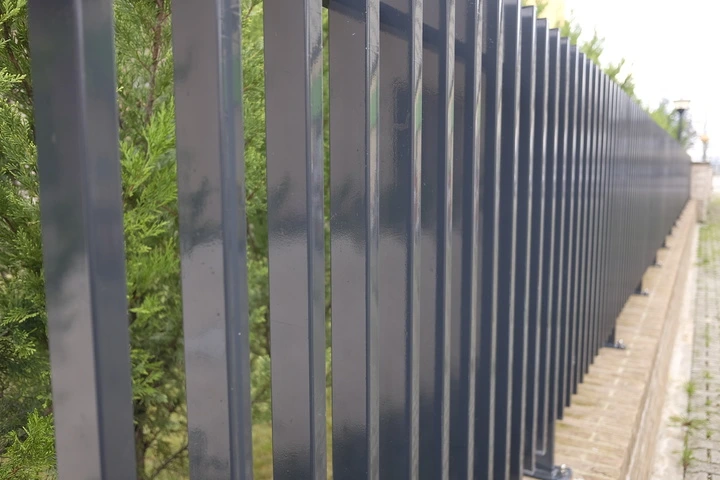 Modern metal fence by Hawkins Landscaping, designed for security and style.